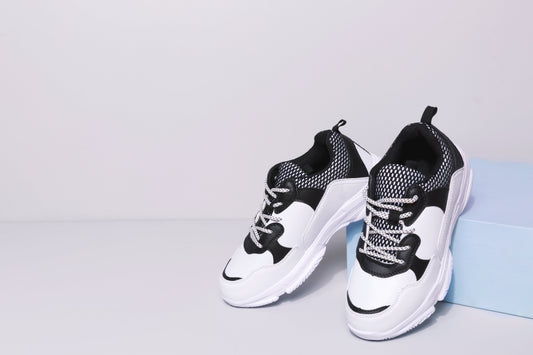 Fashionable Black And White Sneakers Photo